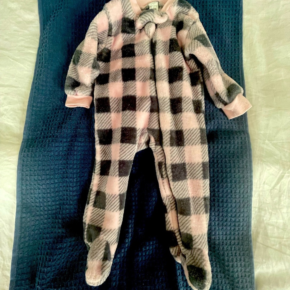 Super cozy long sleeve onesie in a modern. Checked pattern